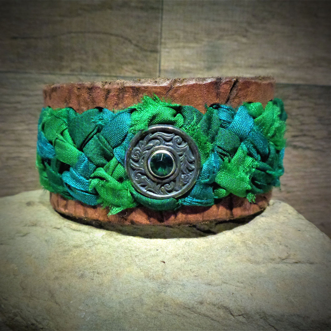 Distressed Green Sari Ribbon Braided Leather Cuff with a Silver and Green Rhinestone Concho